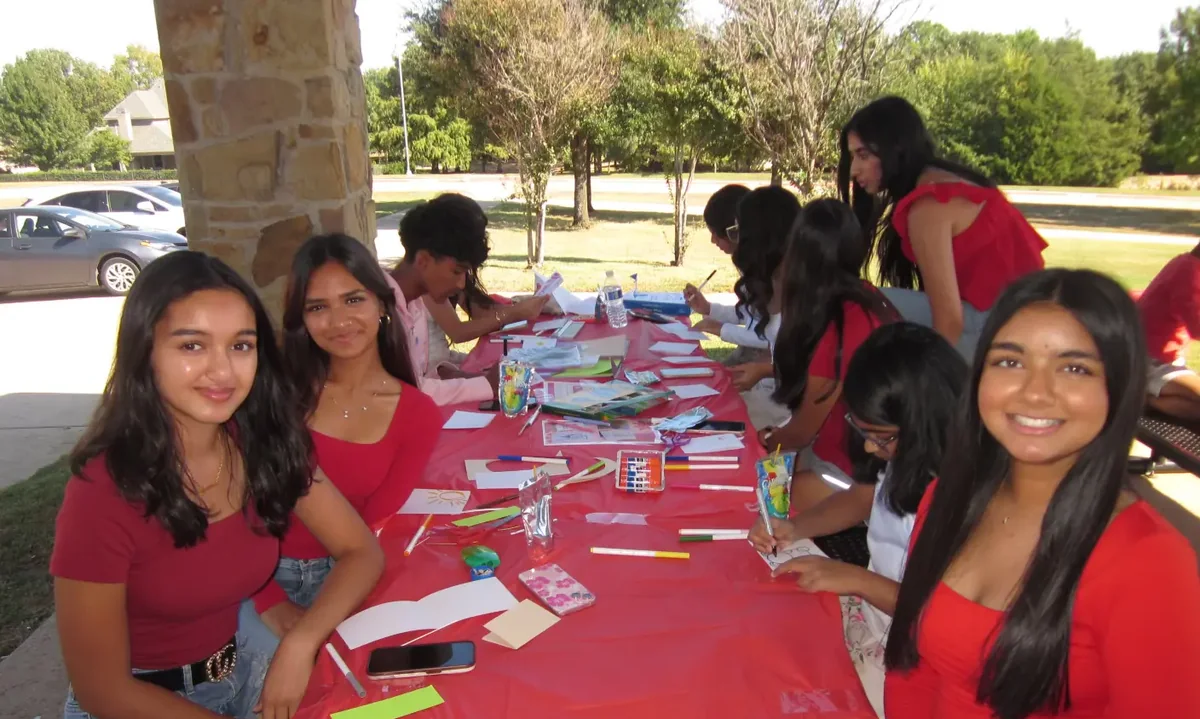 Heart to Heart students making handmade get-well cards together for cardiac patients.